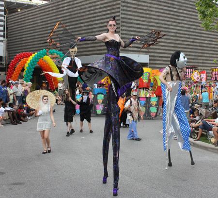 Woman on stilts at Parade the Circle in University Circle