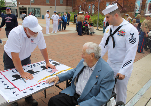 World War II Veterans signing the banner