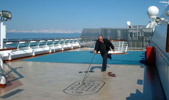 Tom playing shuffle board