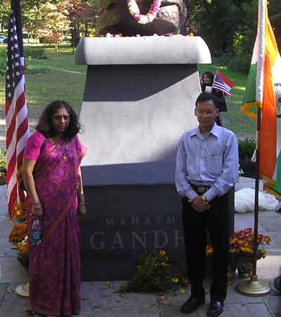 People posing by the new Mahatma Gandhi statue