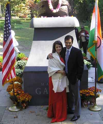 People posing by the new Mahatma Gandhi statue