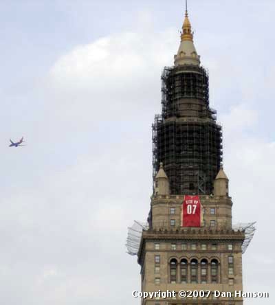 Cleveland Cavalier jersey on Terminal Tower - a plane flies by