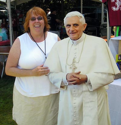 Debbie Hanson poses with cutout of Pope Benedict XVI