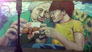 From mural painted on wall on Mayfield in Little Italy