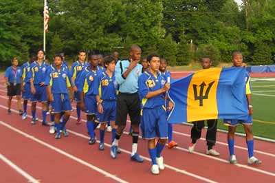 Soccer players from Barbados parade into Don Shula stadium