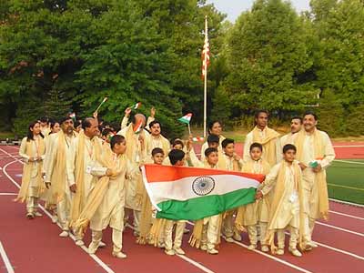 Soccer players from India parade into Don Shula stadium