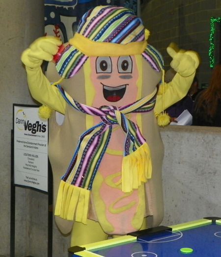 Indians mascot Mustard playing air hockey