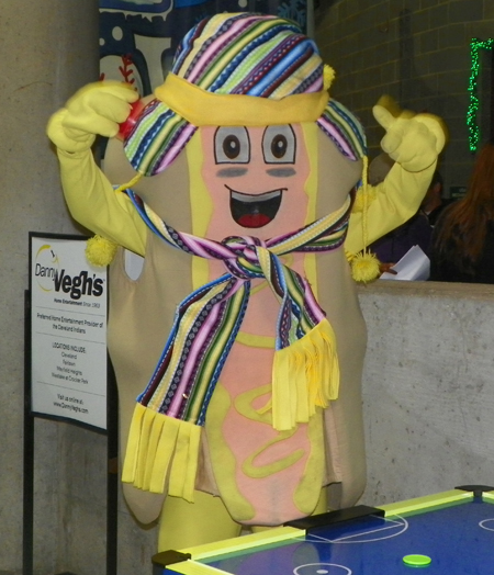 Indians mascot Mustard playing air hockey