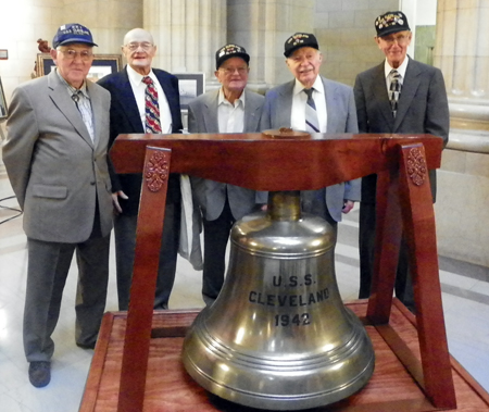 USS Cleveland crew with ship bell