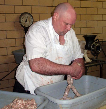 Butcher Ed Jesse about to make sausage links