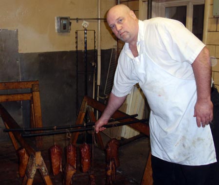 Ed Jesse of Old World Meats with smoked cottage hams