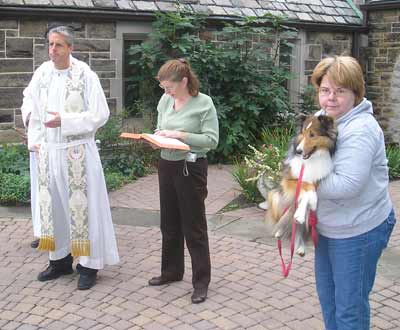 Father Chris Weber with dachsund and collie