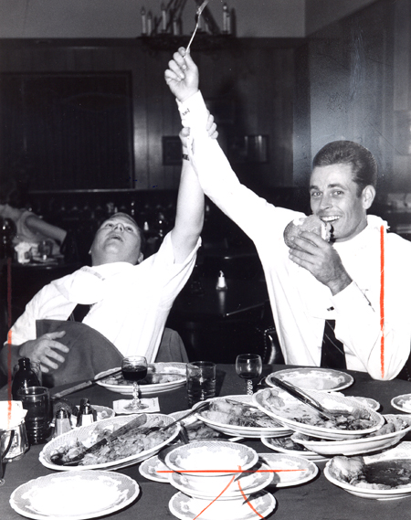 Dan Coughlin in eating contest with Indians 2nd baseman Vern Fuller at Pat Joyce's - Fuller won