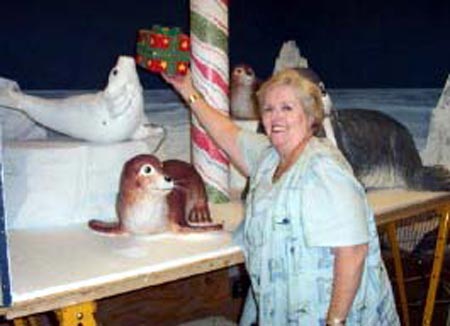 Adele Malley with Christmas display