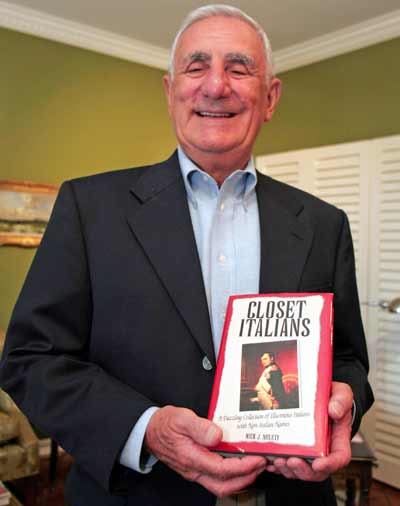 Nick Mileti holding his book Closet Italians