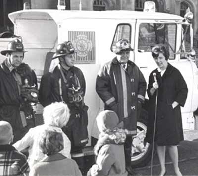 Fireman James Bud Sweeney with Romper Room's Miss Barbara Plummer