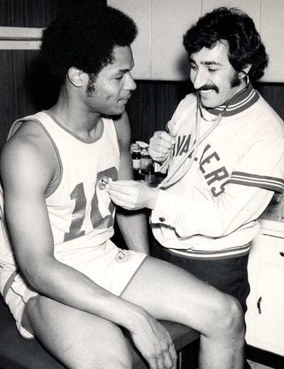 Dr. Larry Morrow checks out Austin Carr of the Cleveland Cavaliers