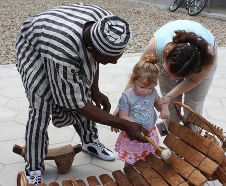 Little girl tries the balafon