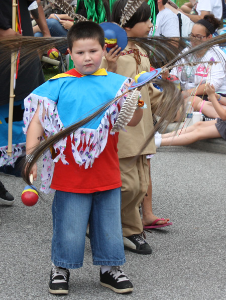 boy with feather at Parade the Circle in University Circle