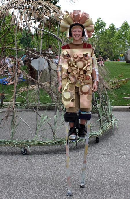 Boy on stilts at Parade the Circle in University Circle