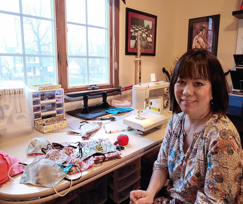 Oanh Loi-Powell at her sewing machine