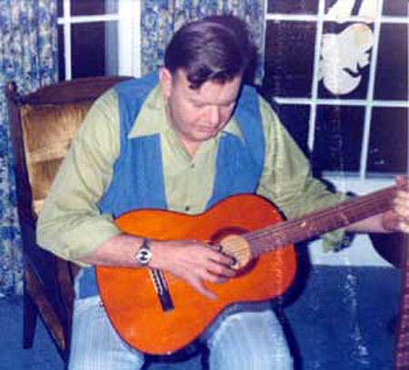 Norm Hanson playing guitar