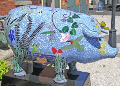 Sowing the Seeds of Peace and Love Pig Sculpture at 1588 East 40th