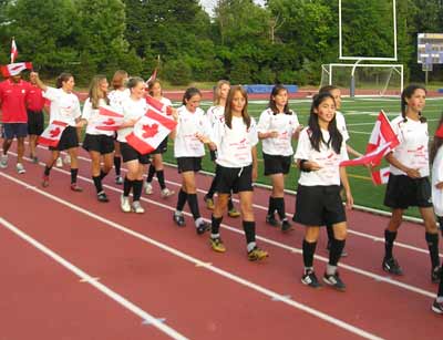 Soccer players from India parade into Don Shula stadium for Opening Ceremonies