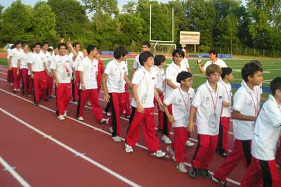 Soccer players from Guatemala parade into Don Shula stadium