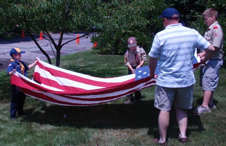 Scouts cutting the US flag