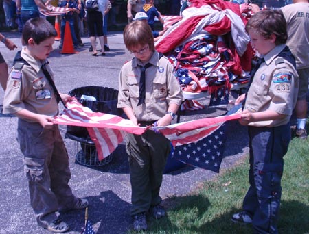 Boy Scouts cutting US flag for retirement