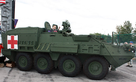 Young boy driving tank