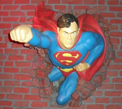 (photos by Dan Hanson) Superman flies through Brick Wall at Maltz Museum