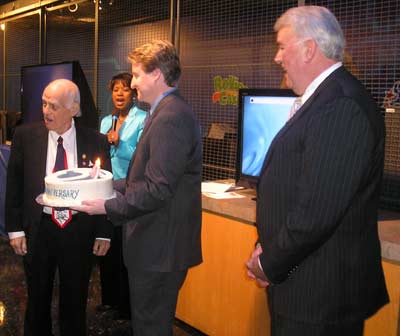 Weatherman Mark Johnson carried the cake during the singing of Happy Birthday