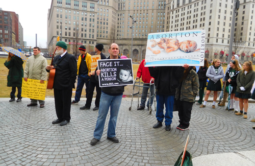 Crowd with pro-life signs calling for respect for the right to life of all