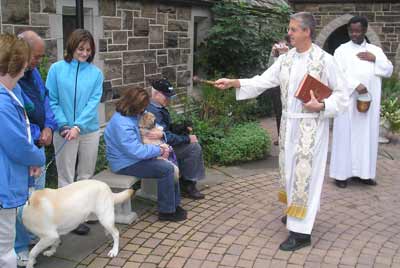 Father Chris blesses the pets