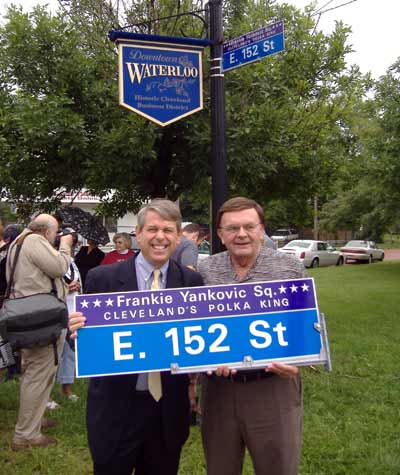 Cleveland councilman Mike Polensek and polka radio host Tony Petkovsek with the new Frankie Yankovic Square signs.