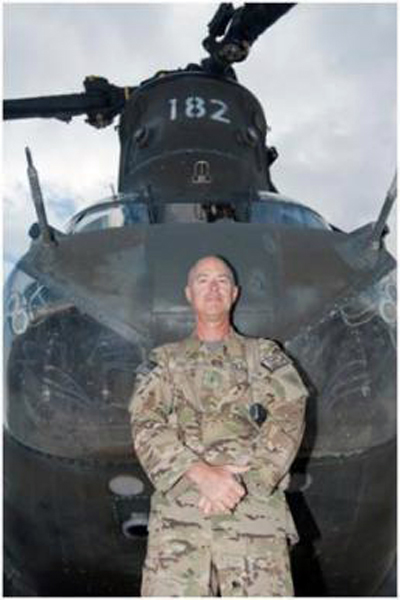 U.S. Army Chief Warrant Officer 2 Blaine Wyckoff, B Company, 3rd Battalion, 238th Aviation, CH-47 Chinook helicopter pilot, a native of Akron, Ohio, who has worked in the aviation field as an enlistee in the Ohio Air National Guard, as an officer and a warrant officer stands with his favorite aircraft, a CH-47 Chinook helicopter, on his final deployment of a 40-year career at Forward Operating Base Salerno, Afghanistan, Oct. 20, 2012 (U.S. Army photo by Sgt. Duncan Brennan, 101st CAB PAO)