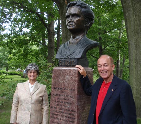 Judge Diane Karpinski and Ben Stefanski with the restored bust of Madame Marie Curie