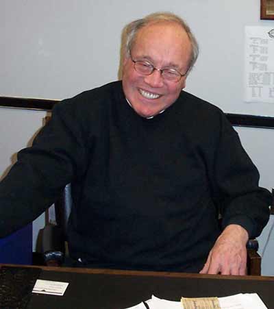 Burt Salzman smiling in his office