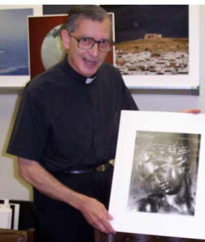 Fr Carreira with one of his photos
