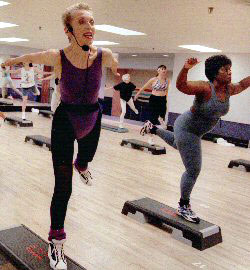 Chris King teaching a step aerobics class