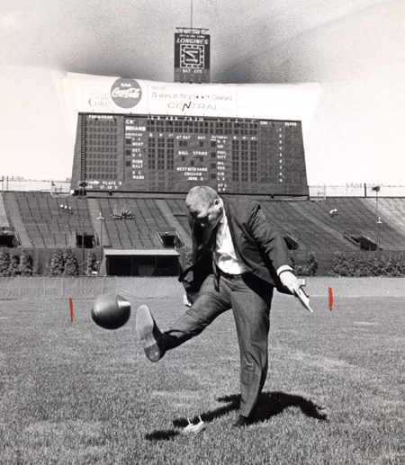 Dan Coughlin kicks football at Cleveland Municipal Stadium in 1965