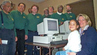 Mayor Jane Campbell with CAP volunteers at a community center PC lab that CAP built