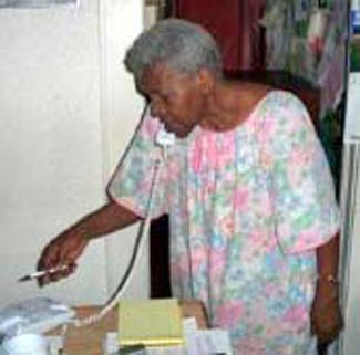 Fannie Lewis working the phones