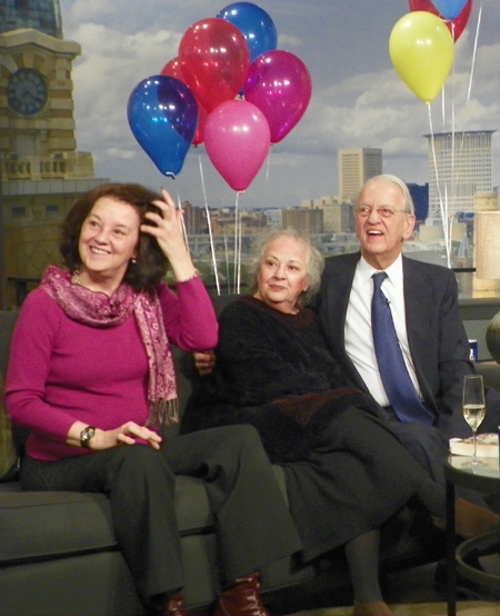 Daughter Barbara, wife Linda and Fred Griffith watch some clips