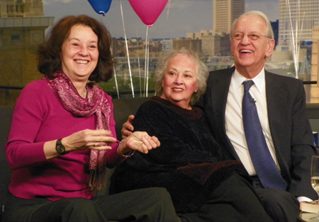 Daughter Barbara, wife Linda and Fred Griffith watch some clips