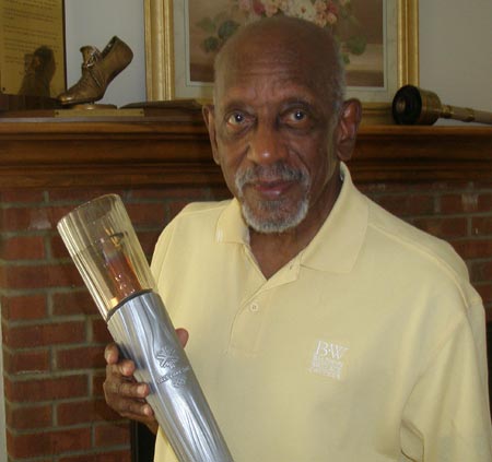 Harrison Dillard holding one of his Olympic torches (photos by Debbie Hanson)