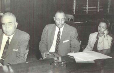 Norman Minor, Louis Stokes and a defendant