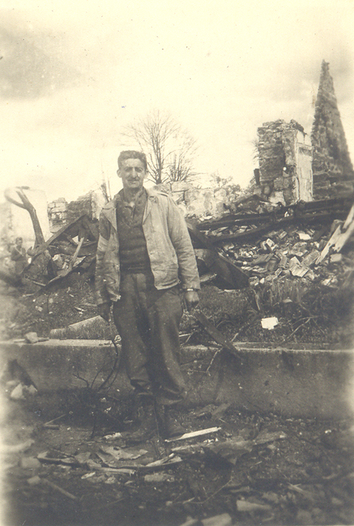Maury Feren in the ruins of a town